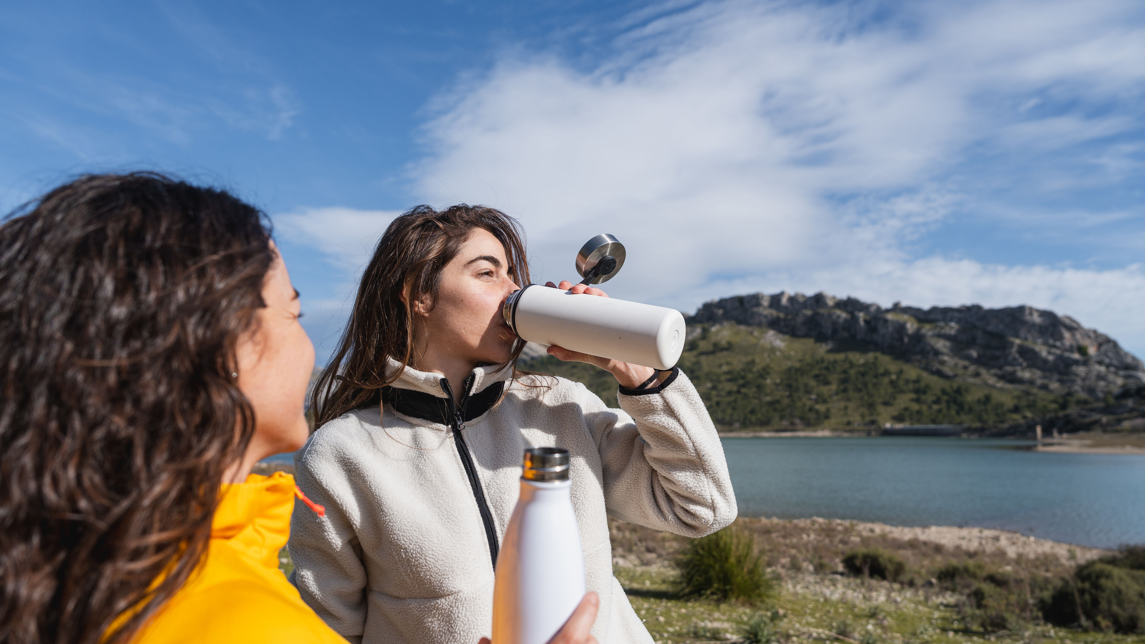 Women Hydrating on a Beautiful Scenic Hike
