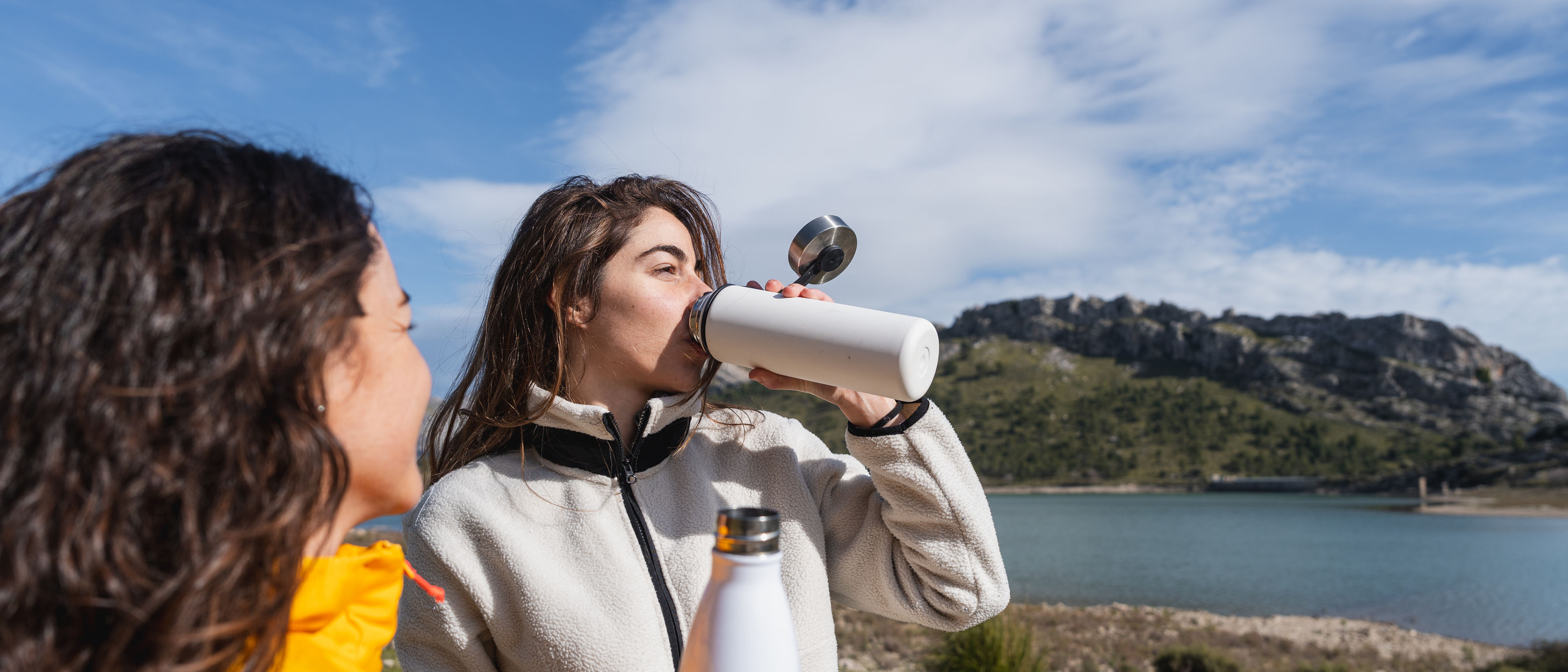 Women Hydrating on a Beautiful Scenic Hike 

 