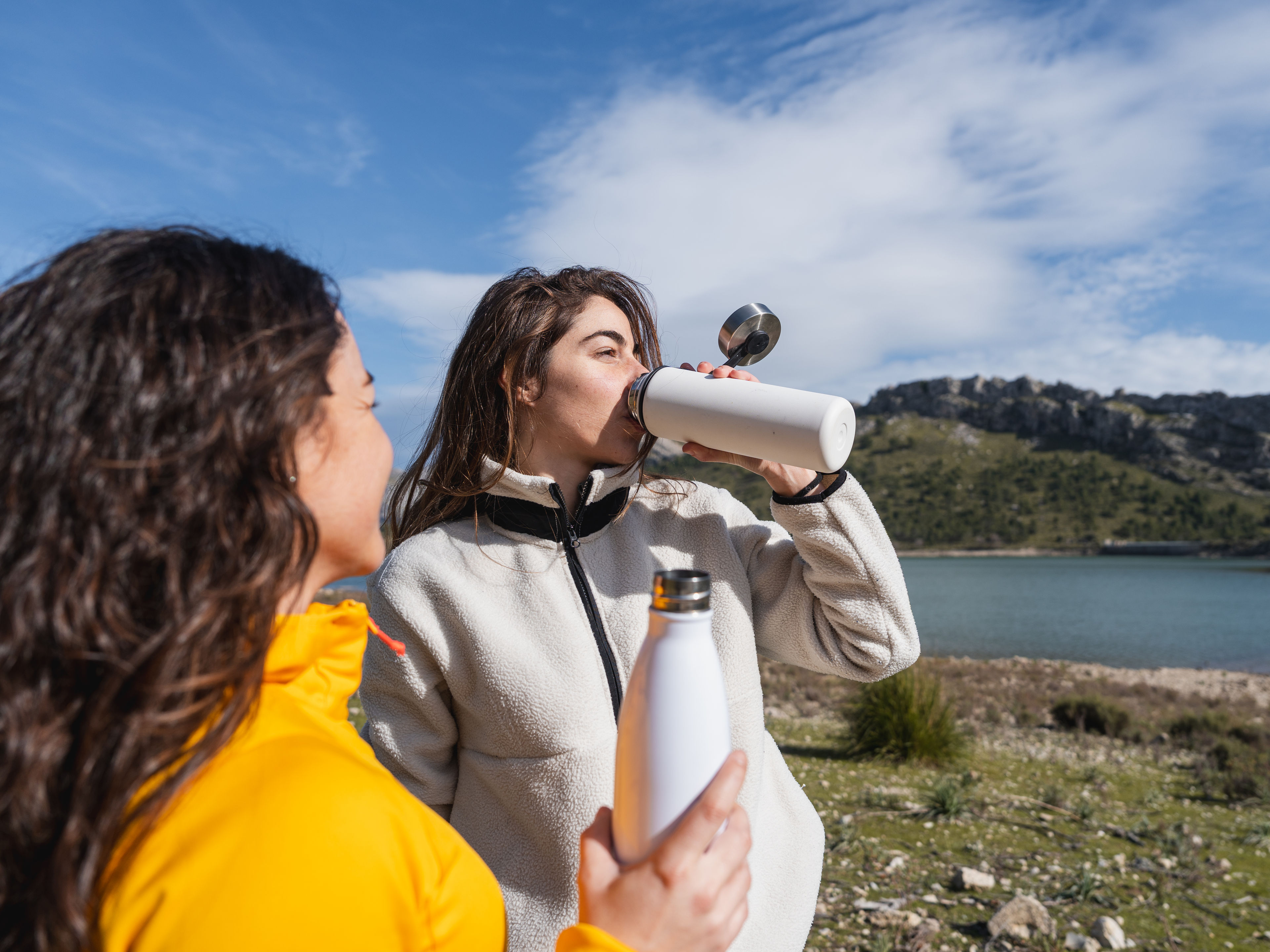 Women Hydrating on a Beautiful Scenic Hike 

 